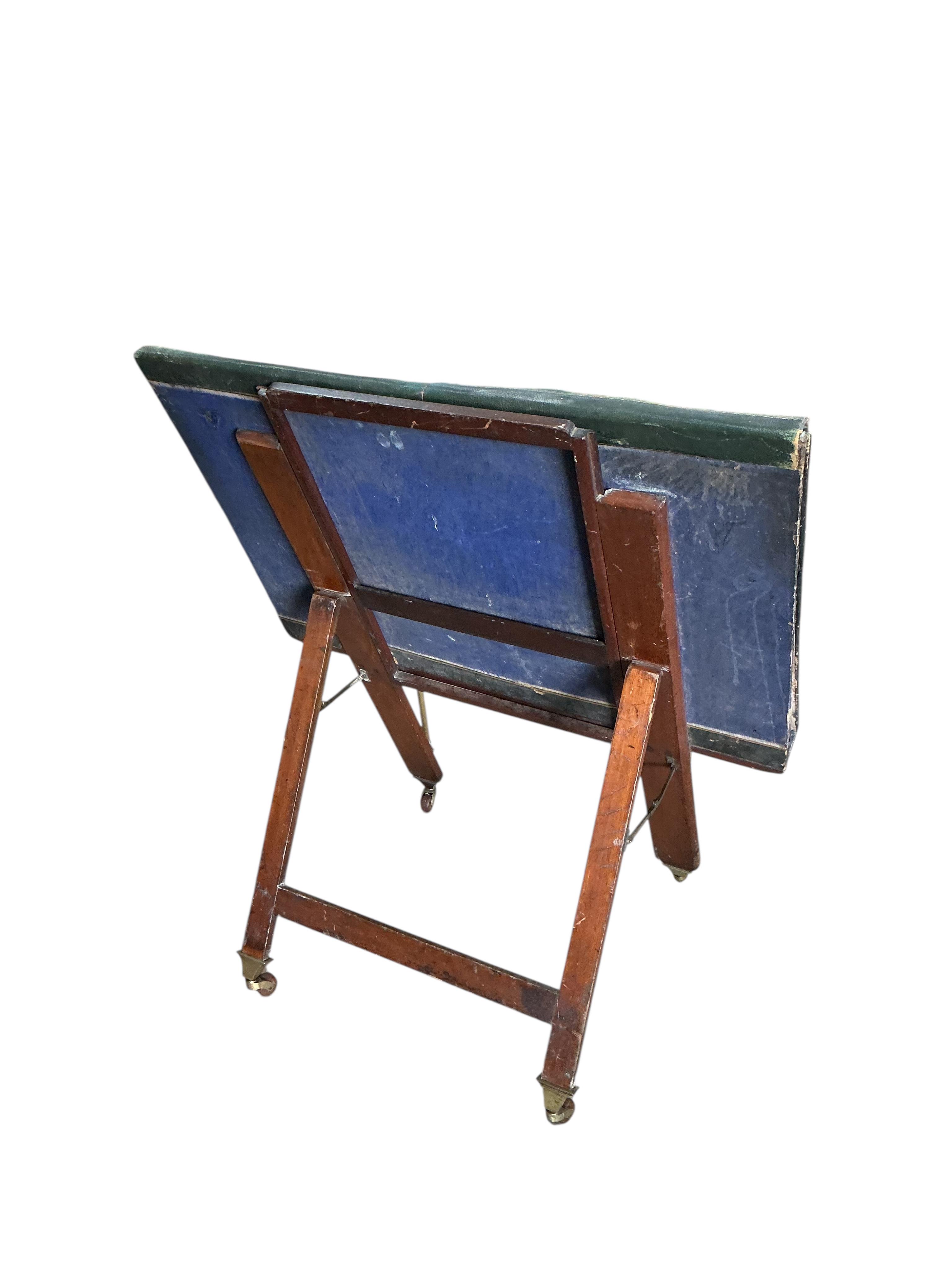 A Victorian brass mounted green morocco folio stand, width 82cm, height 90cm